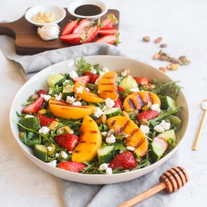 Grilled Peach, Strawberry & Arugula Salad with Pistachios & Goat Cheese